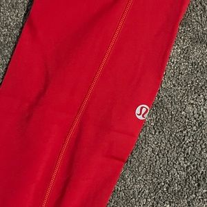 Two pairs of lulu lemon leggings with phone pockets.